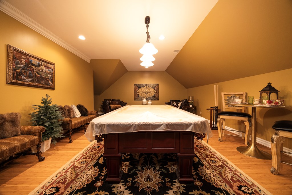 595 Grey Rock Drive Midland, GA 31820 - Photo 66 of 95 a spacious bedroom with a bed and a chandelier