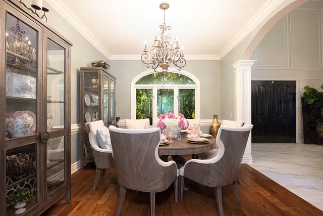 a kitchen with stainless steel appliances granite countertop a sink a stove and cabinets