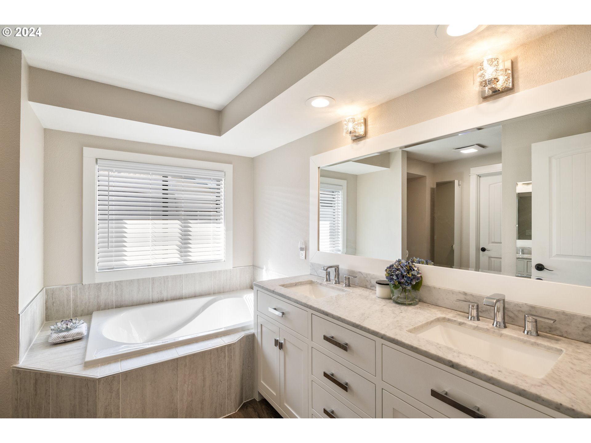 2718 Northeast 164th Street Ridgefield, WA 98642 - Photo 18 of 33 a bathroom with a granite countertop sink mirror bathtub and double