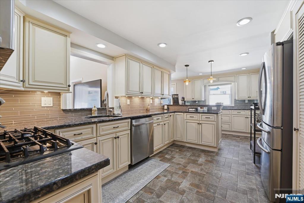 72 West Saddle River Road Waldwick, NJ 07463 - Photo 12 of 50 a kitchen with a sink stove and refrigerator