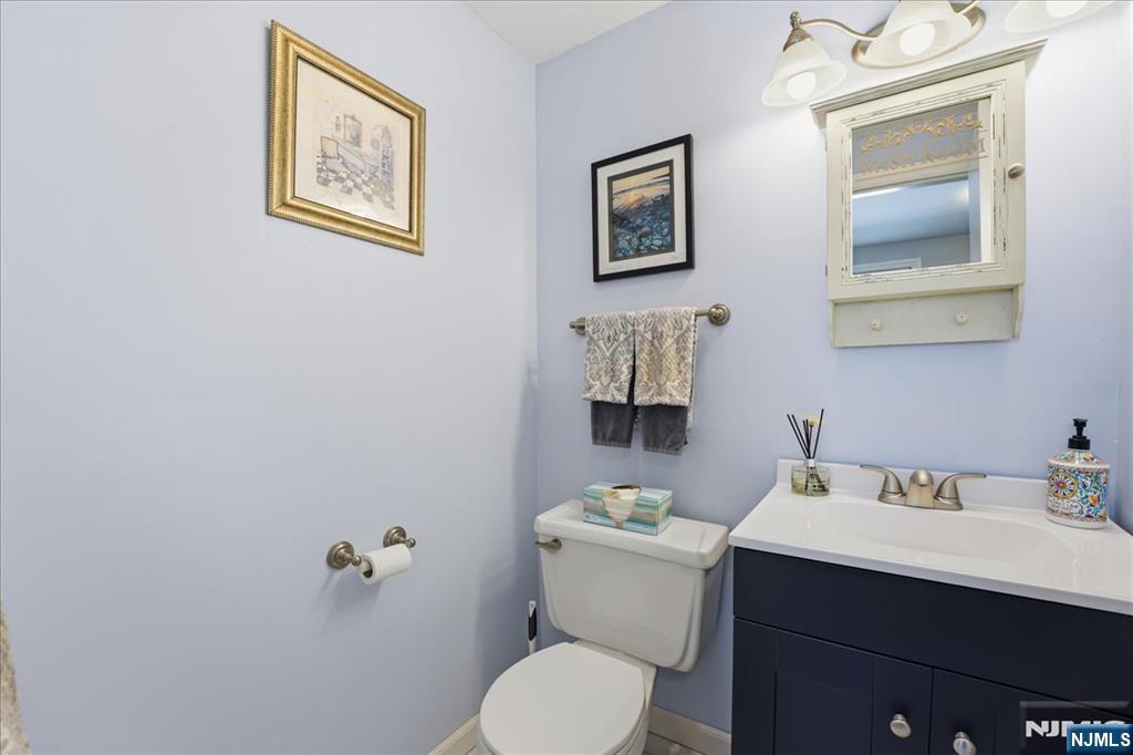 72 West Saddle River Road Waldwick, NJ 07463 - Photo 19 of 50 a bathroom with a toilet sink and mirror