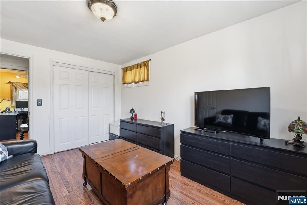 72 West Saddle River Road Waldwick, NJ 07463 - Photo 24 of 50 a living room with furniture and a flat screen tv