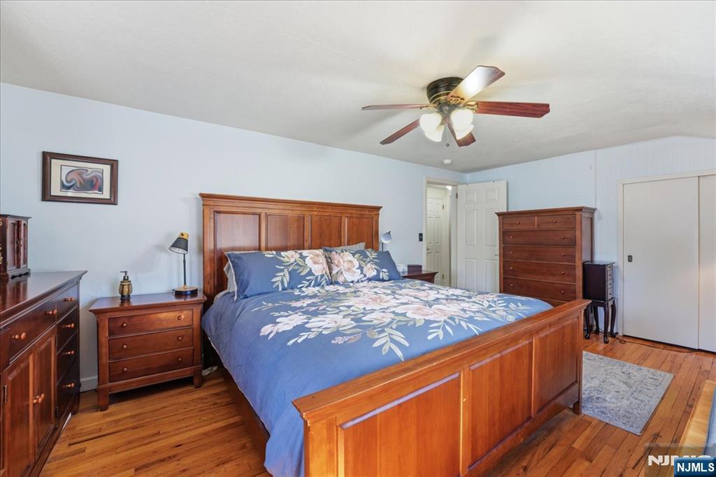 72 West Saddle River Road Waldwick, NJ 07463 - Photo 25 of 50 a bed room with a bed and wooden floor