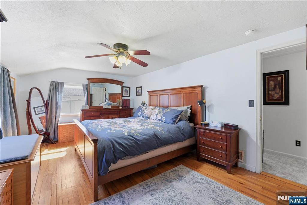 72 West Saddle River Road Waldwick, NJ 07463 - Photo 26 of 50 a bedroom with bed and a chandelier