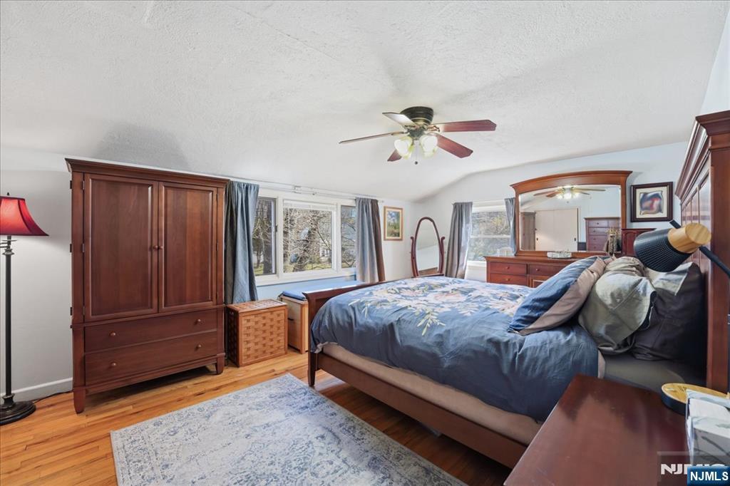 72 West Saddle River Road Waldwick, NJ 07463 - Photo 27 of 50 a bedroom with a bed and wooden floor