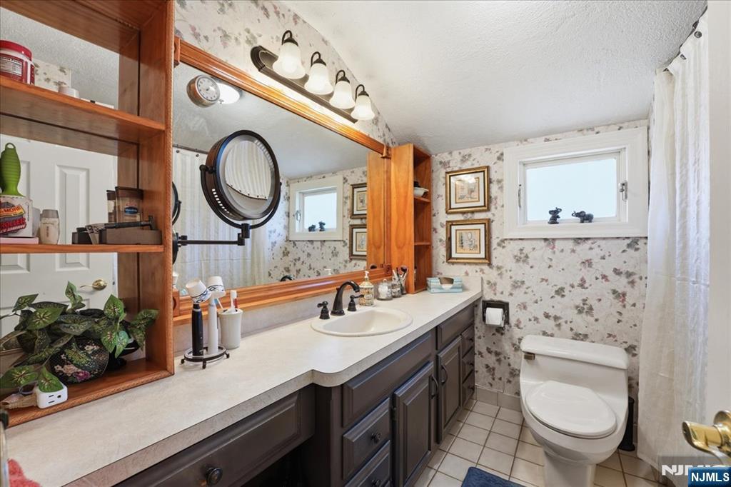 72 West Saddle River Road Waldwick, NJ 07463 - Photo 28 of 50 a bathroom with a toilet a sink and a mirror