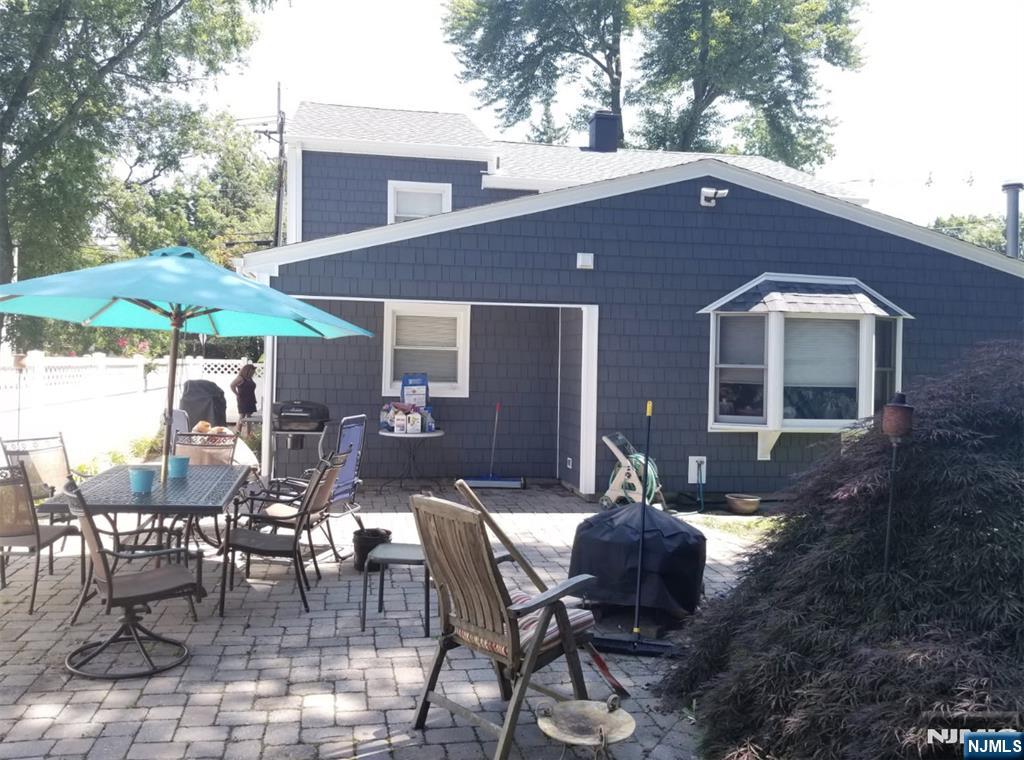 72 West Saddle River Road Waldwick, NJ 07463 - Photo 36 of 50 a backyard of a house with table and chairs