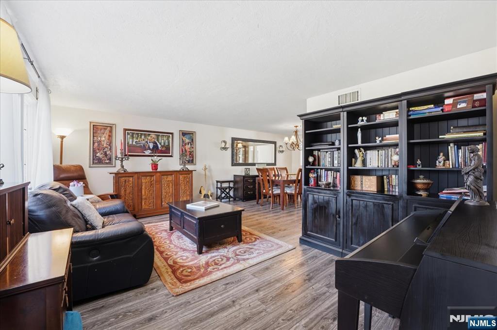 72 West Saddle River Road Waldwick, NJ 07463 - Photo 7 of 50 a living room with furniture and a book shelf
