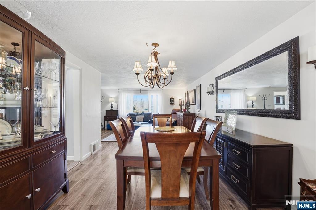 72 West Saddle River Road Waldwick, NJ 07463 - Photo 9 of 50 a view of a dining room with furniture and a chandelier