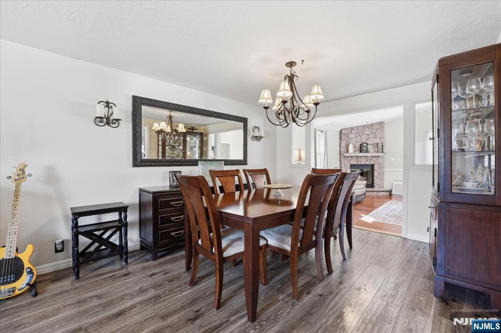 72 West Saddle River Road Waldwick, NJ 07463 - Photo 10 of 50 a view of a dining room with furniture a chandelier and wooden floor