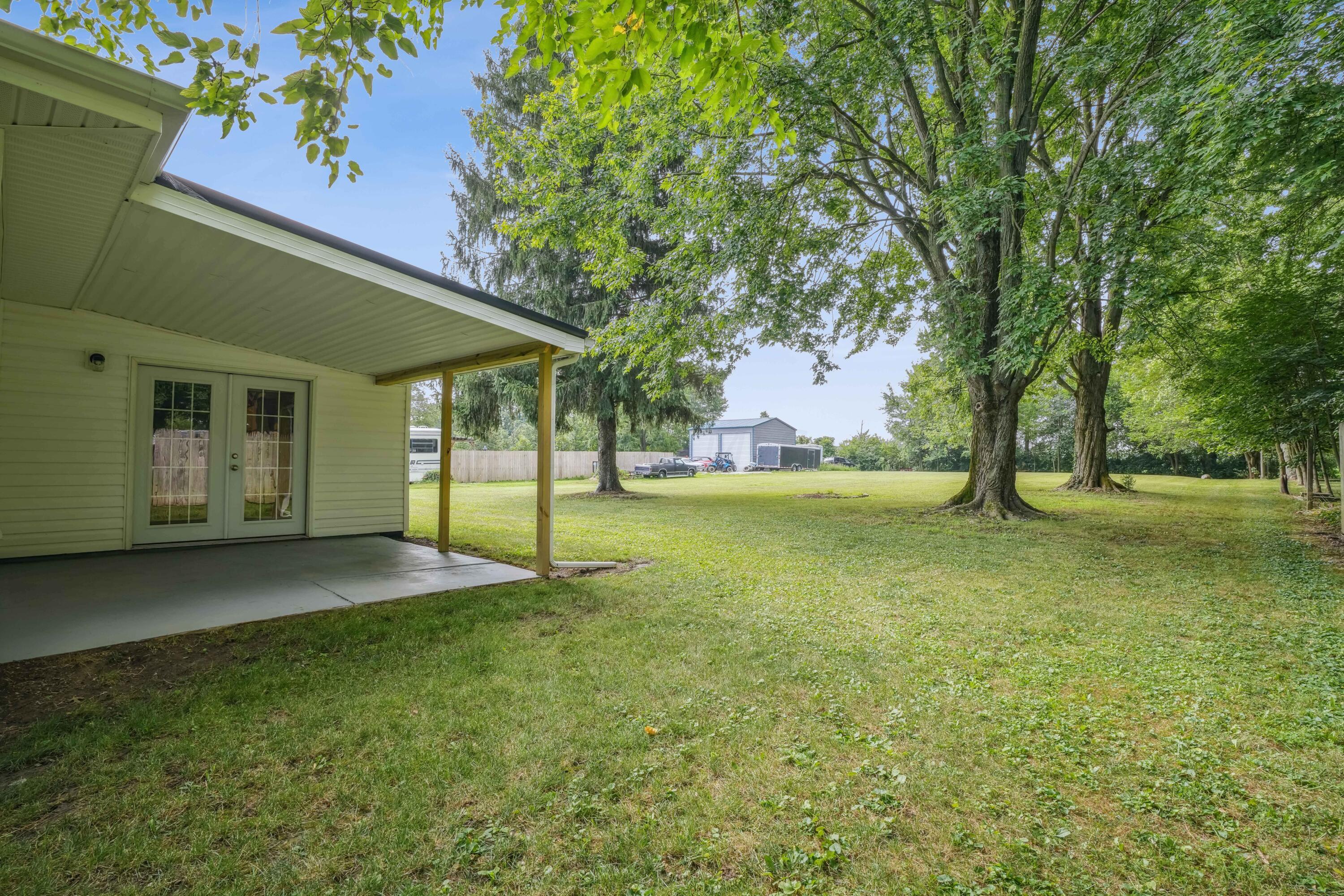 6705 Johnson Road Galloway, OH 43119 - Photo 27 of 30 Covered private back patio, perfect for relaxing and enjoying the views of the backyard!