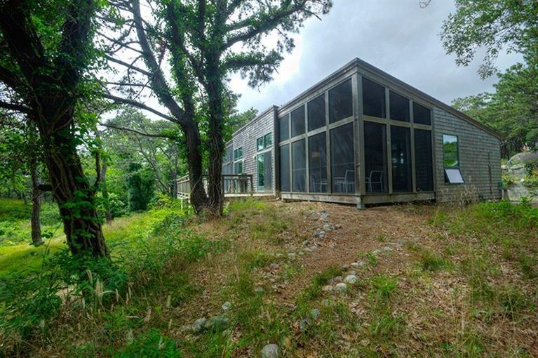 a view of an house with backyard space and garden