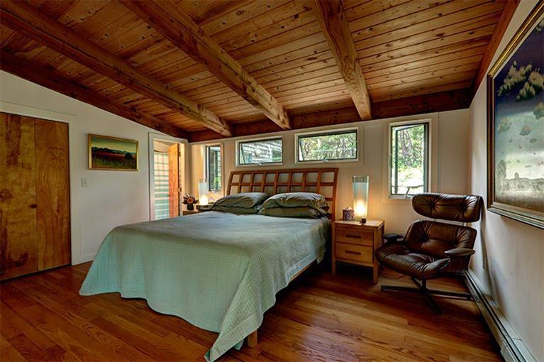 7 Horseleech Road Truro, MA 02666 - Photo 6 of 35 a bedroom with a bed next to a window