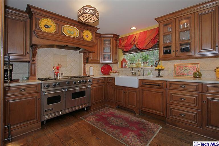 1895 Virginia Road San Marino, CA 91108 - Photo 17 of 45 a kitchen with stainless steel appliances granite countertop a stove and a sink