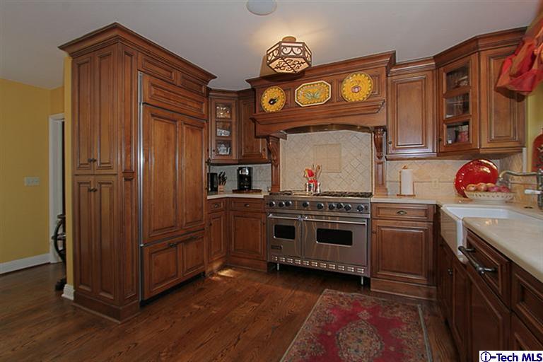 1895 Virginia Road San Marino, CA 91108 - Photo 18 of 45 a kitchen with stainless steel appliances granite countertop a stove and cabinets