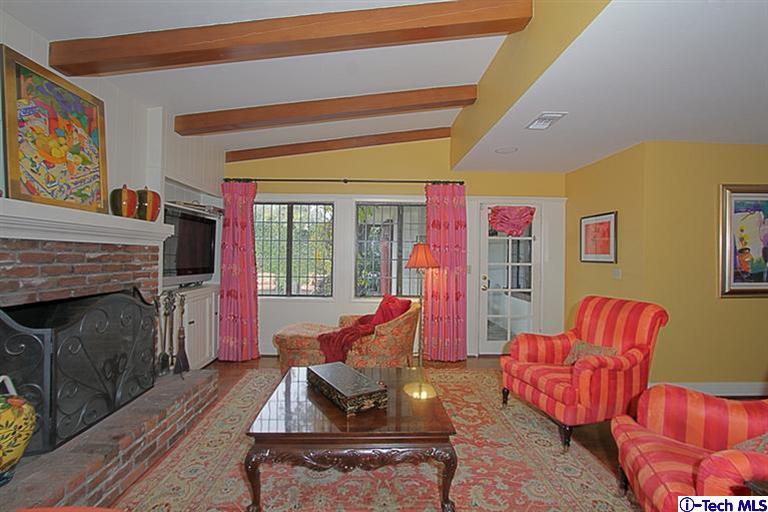 1895 Virginia Road San Marino, CA 91108 - Photo 23 of 45 a living room with furniture a flat screen tv and a fireplace