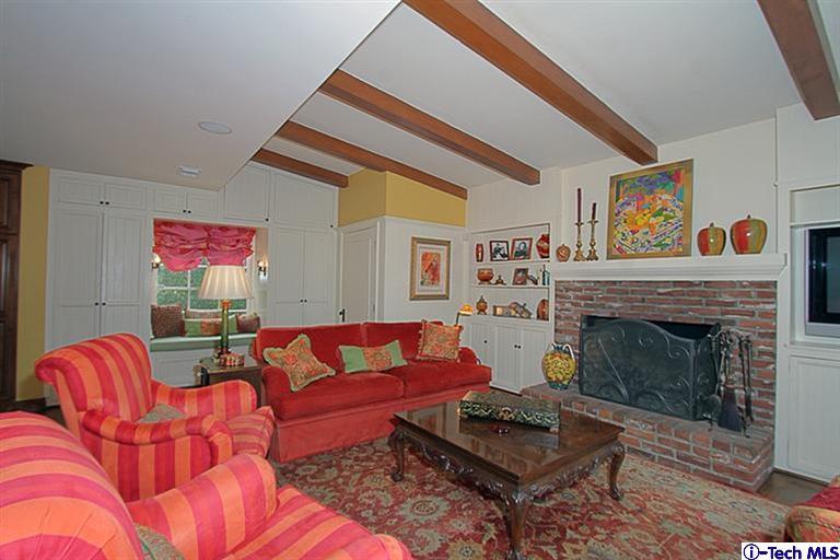 1895 Virginia Road San Marino, CA 91108 - Photo 24 of 45 a living room with furniture a fireplace and a large window