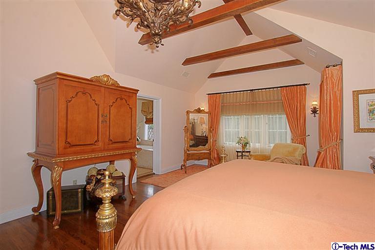 1895 Virginia Road San Marino, CA 91108 - Photo 26 of 45 a bed sitting in a bedroom next to a window
