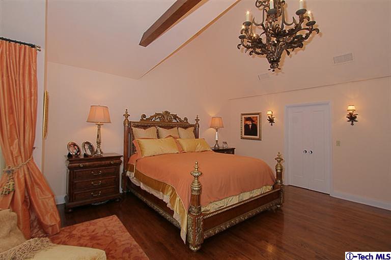1895 Virginia Road San Marino, CA 91108 - Photo 27 of 45 a bed sitting in a bedroom next to a window