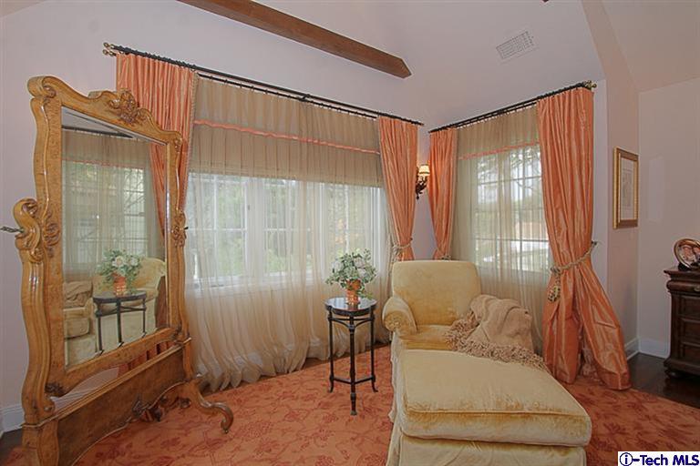 1895 Virginia Road San Marino, CA 91108 - Photo 28 of 45 a living room with furniture a flat screen tv and a window