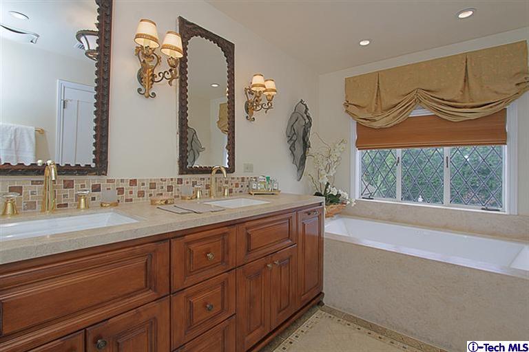 1895 Virginia Road San Marino, CA 91108 - Photo 29 of 45 a bathroom with a sink and a mirror
