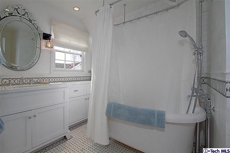 1895 Virginia Road San Marino, CA 91108 - Photo 34 of 45 a bathroom with a sink a vanity and a mirror