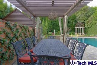 1895 Virginia Road San Marino, CA 91108 - Photo 38 of 45 a view of a patio with table and chairs with wooden floor and plants