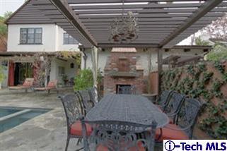 1895 Virginia Road San Marino, CA 91108 - Photo 39 of 45 a view of a patio with table and chairs with wooden floor and fence