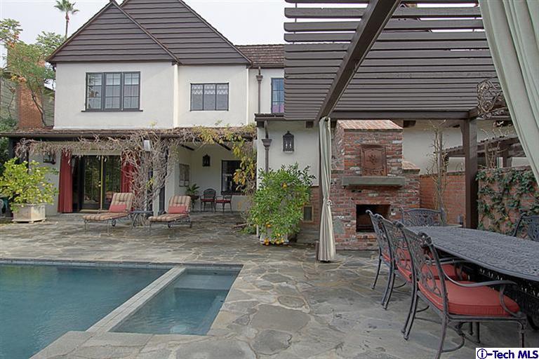 1895 Virginia Road San Marino, CA 91108 - Photo 40 of 45 a view of a house with a chairs and table in a patio