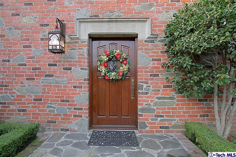 1895 Virginia Road San Marino, CA 91108 - Photo 5 of 45 a stone house with potted plants in front of door