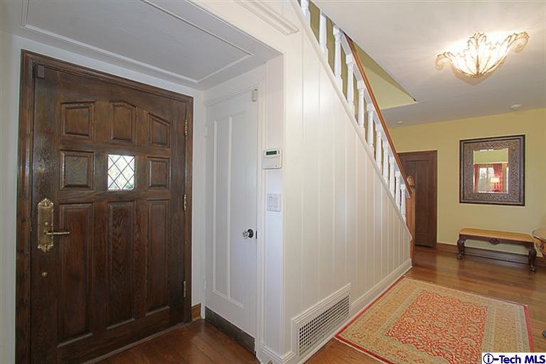 1895 Virginia Road San Marino, CA 91108 - Photo 6 of 45 a view of a hallway with wooden floor and stairs