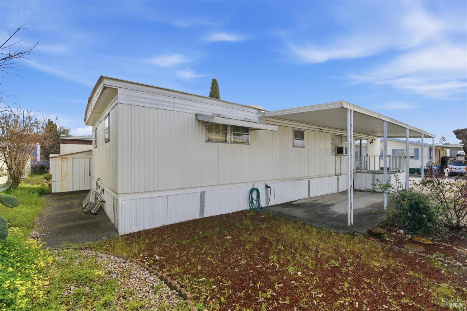 305 Aileen Avenue Santa Rosa, CA 95407 - Photo 3 of 15 a backyard of a house with shaded area