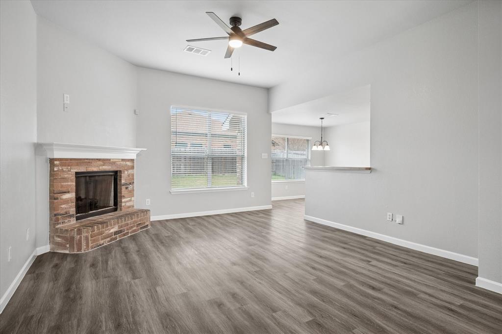 1012 Rio Verde Drive DeSoto, TX 75115 - Photo 2 of 14 LR-end of LR-DR combo with corner fireplace