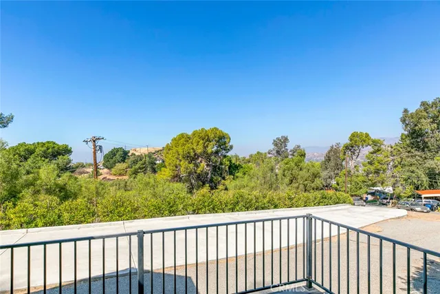 a balcony with table and chairs