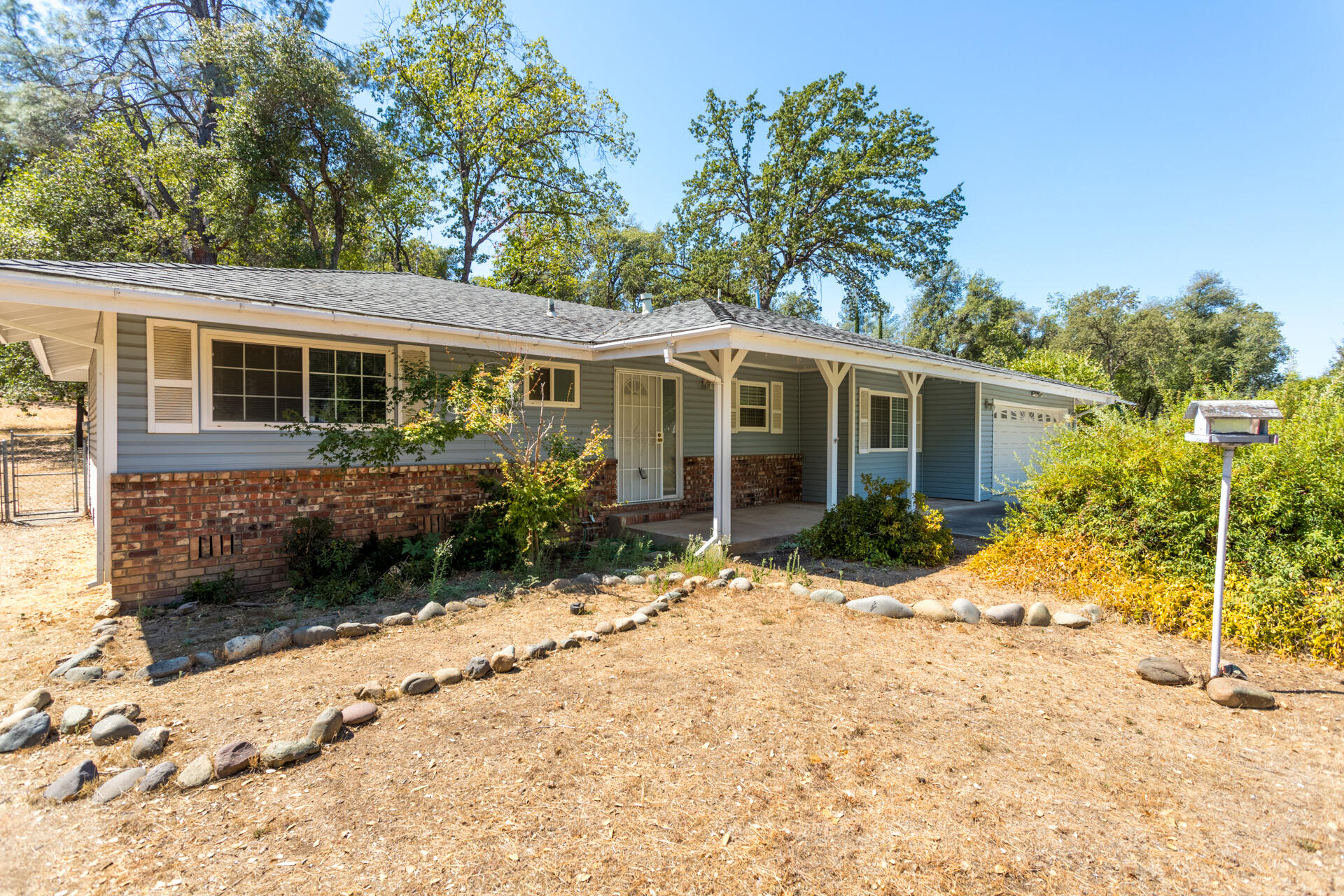 8850 Redbank Road Redding, CA 96001 - Photo 1 of 18 front view of a house with a yard