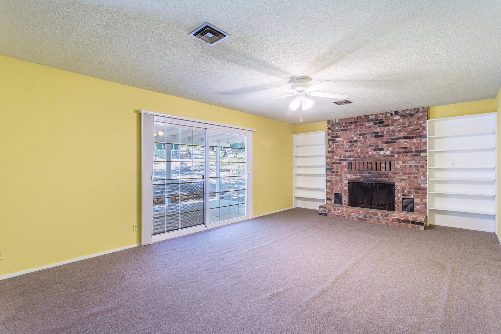 8850 Redbank Road Redding, CA 96001 - Photo 6 of 18 a view of a livingroom with a fireplace