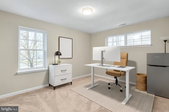 a workspace with a desk and a window