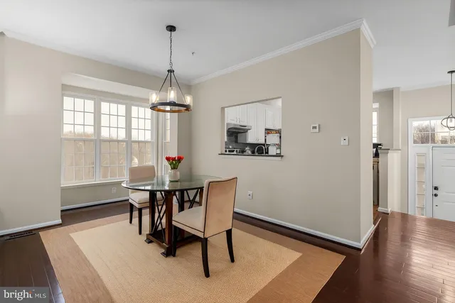 a dining room with furniture window wooden floor