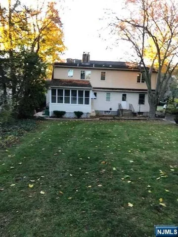 a house view with a sitting space and garden