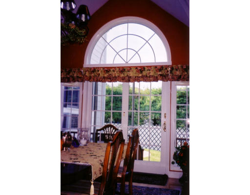 41 Elmcrest Road Wakefield, MA 01880 - Photo 4 of 5 a view of a dining room with furniture and a window