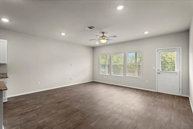a view of an empty room with a window