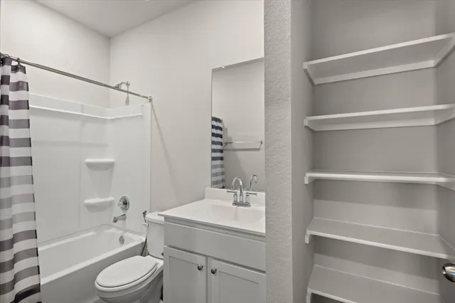 a bathroom with a sink a toilet and a bathtub