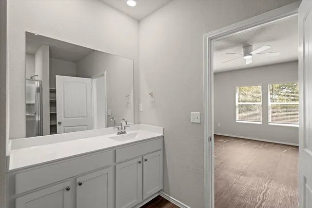 a bathroom with a sink double vanity and a mirror