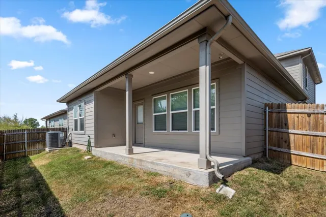 a view of house with backyard