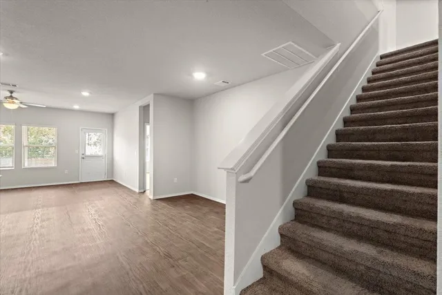 a view of an entryway with wooden floor