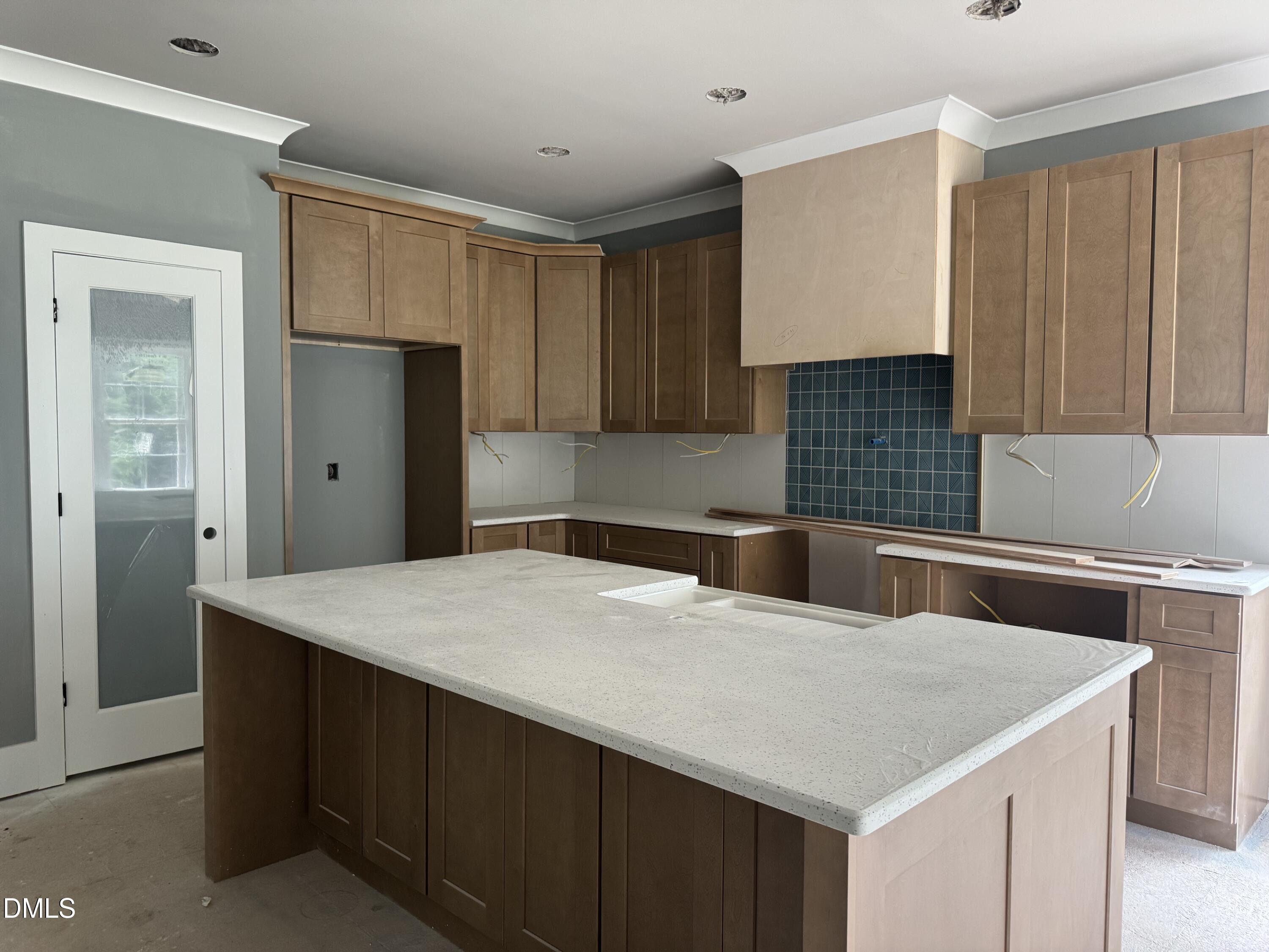 935 Lynch Road Selma, NC 27576 - Photo 4 of 21 a kitchen with stainless steel appliances a kitchen island a sink dishwasher a refrigerator and cabinets with wooden floor