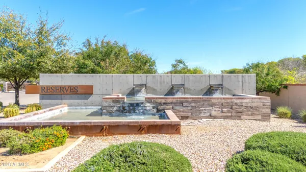 a view of swimming pool with outdoor seating and plants