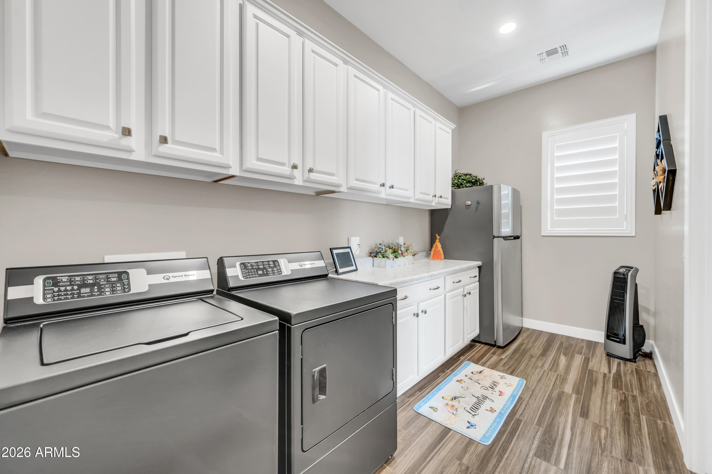 1867 East Gillcrest Road Gilbert, AZ 85298 - Photo 24 of 48 a kitchen with granite countertop a sink stainless steel appliances and cabinets