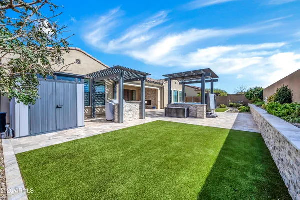 a view of an house with backyard porch and furniture