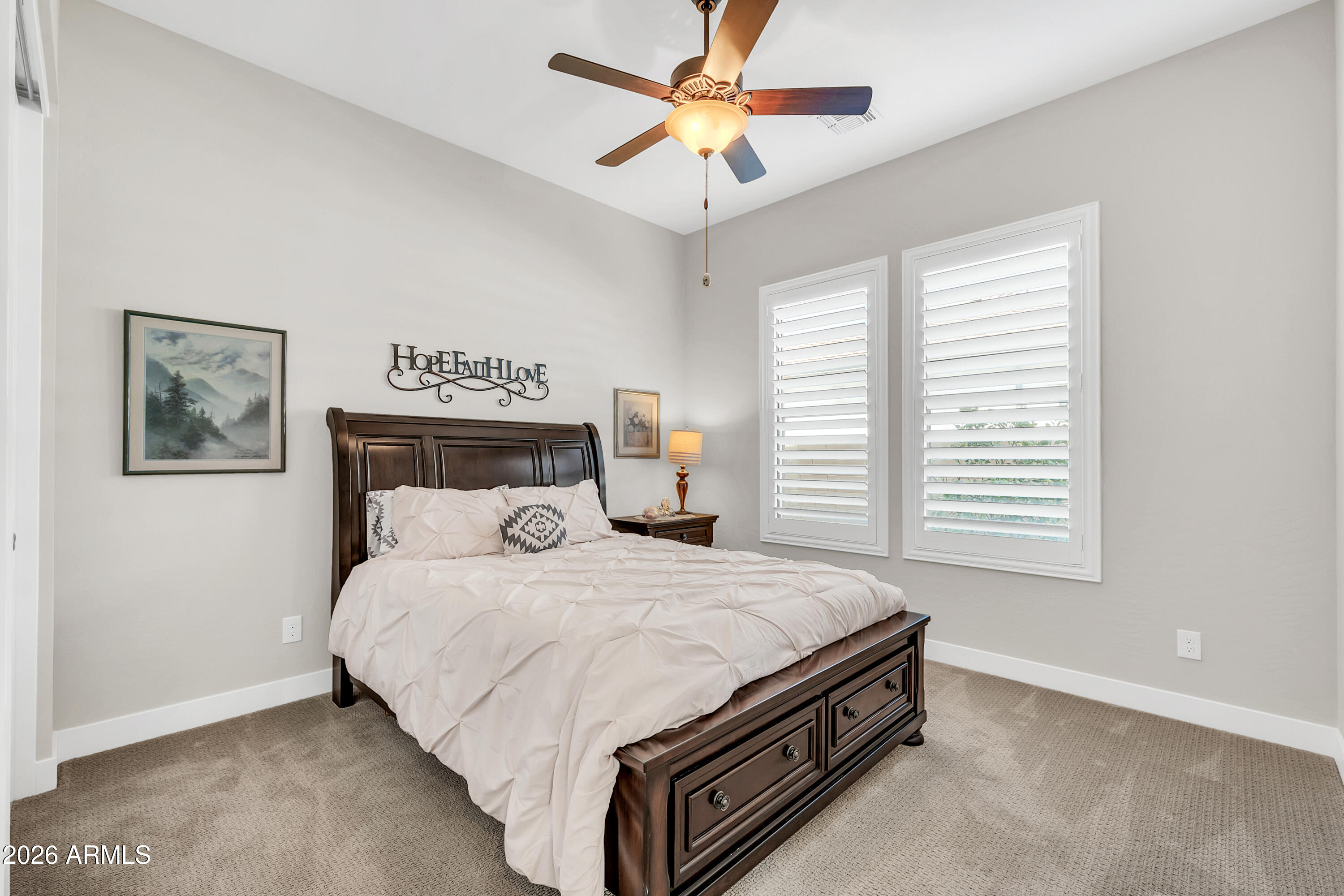 1867 East Gillcrest Road Gilbert, AZ 85298 - Photo 28 of 48 a bedroom with a bed and a chandelier